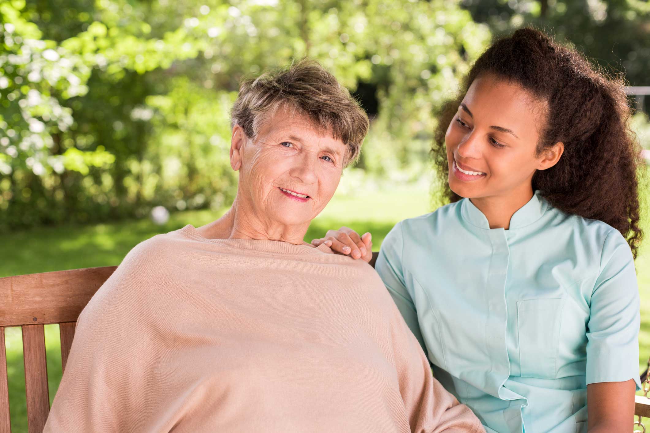 Elderly woman with caregiver.