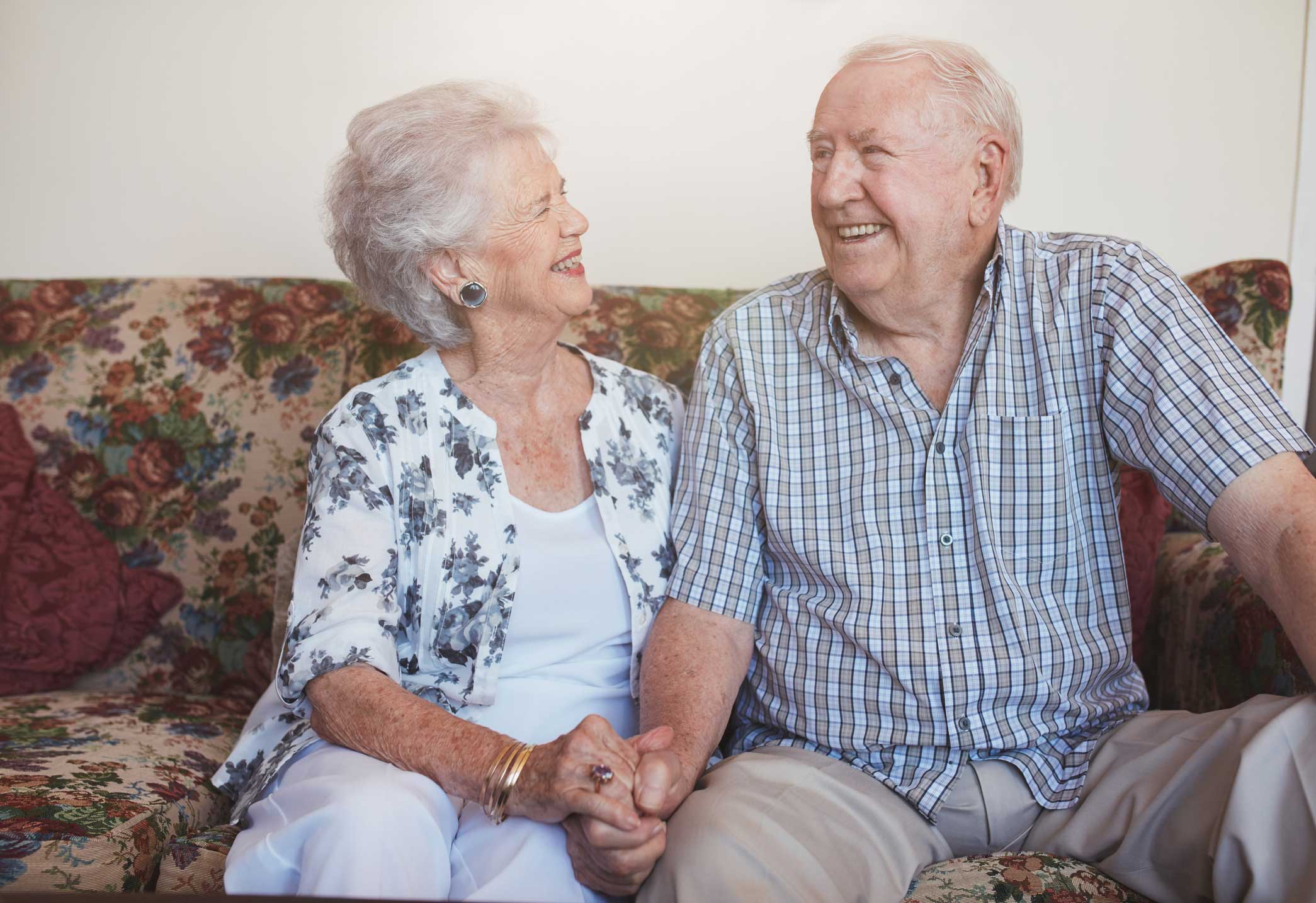 Older couple on couch.