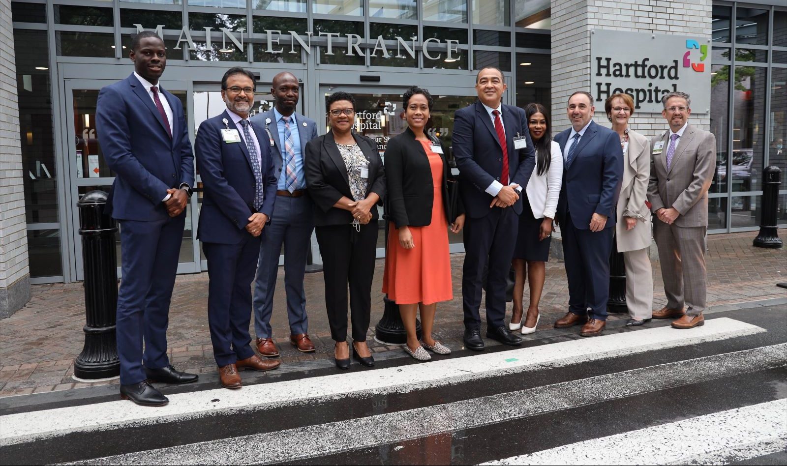 Health experts pose in front of Hartford Hospital.