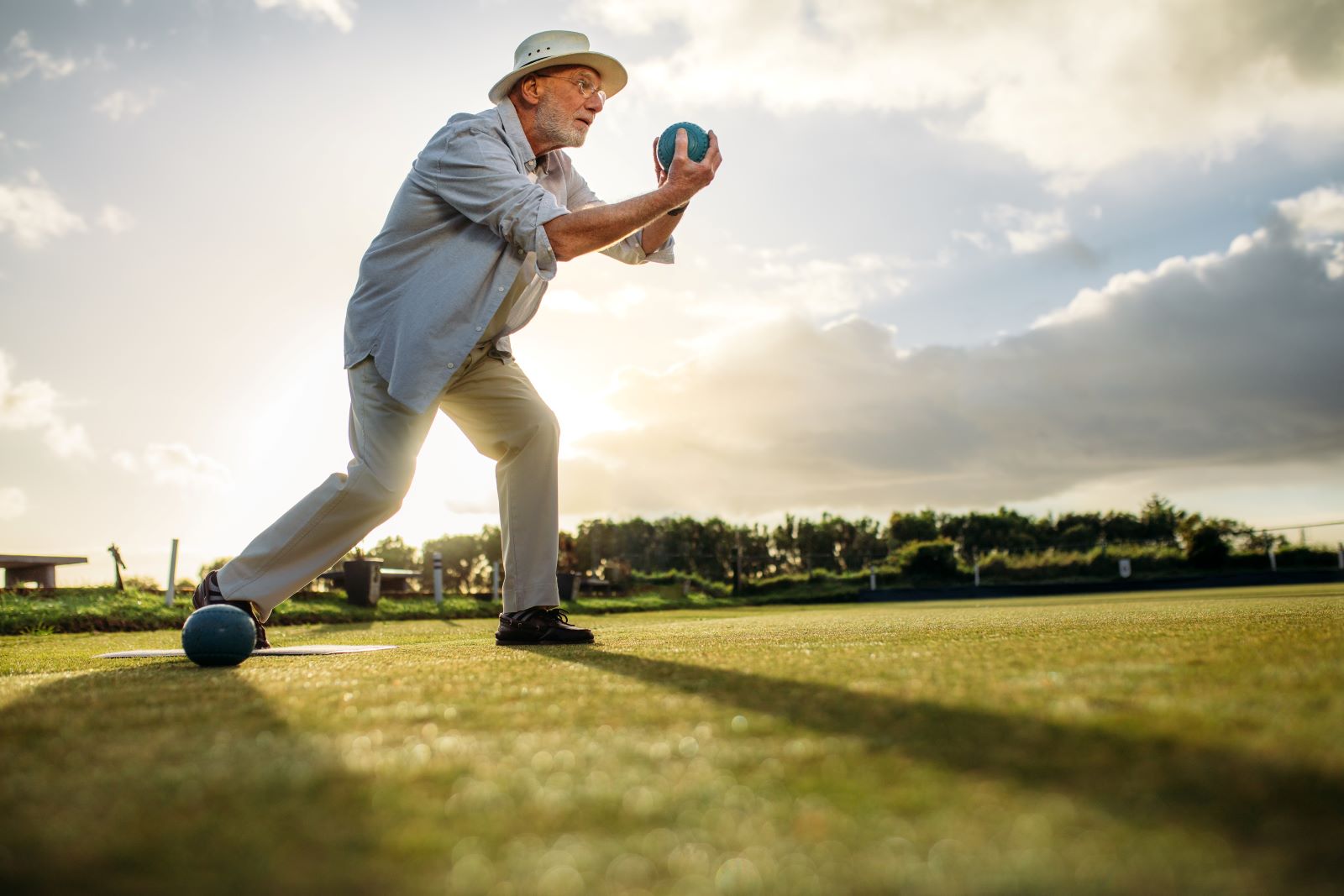 Man plays bocce.