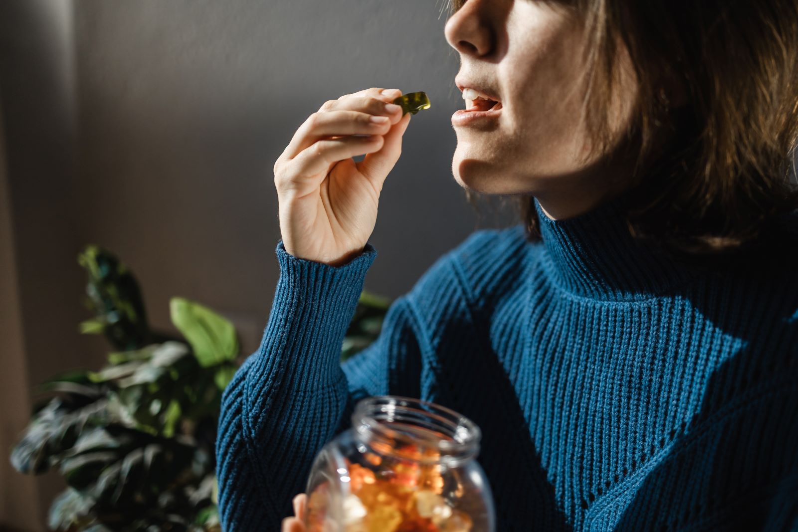 A woman takes an edible.