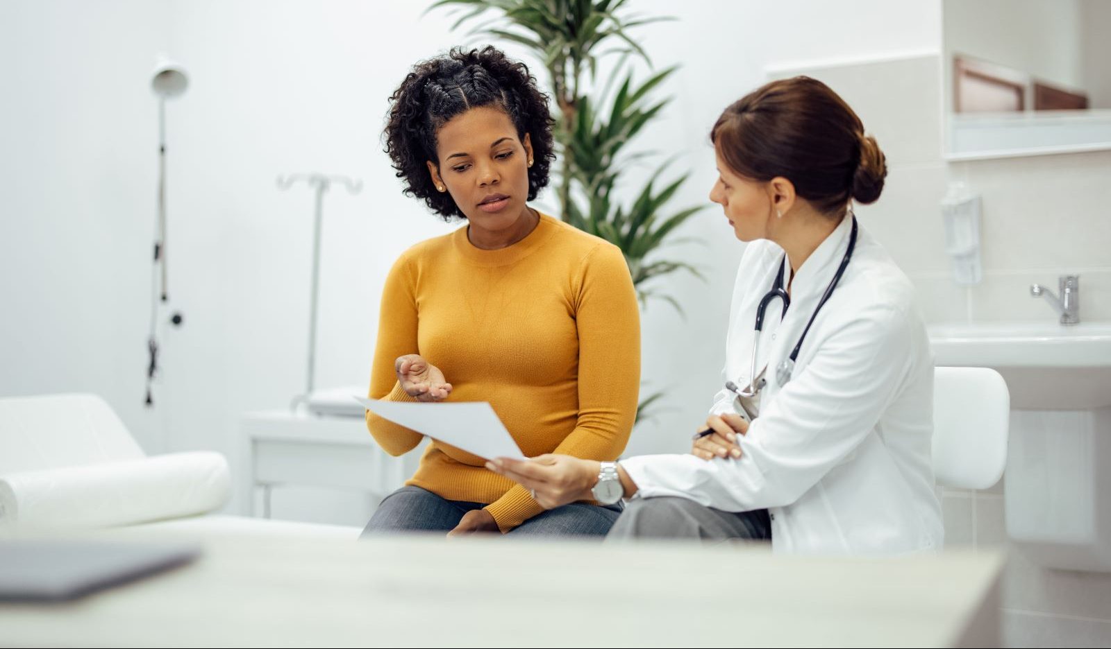 A doctor talks to her patient.