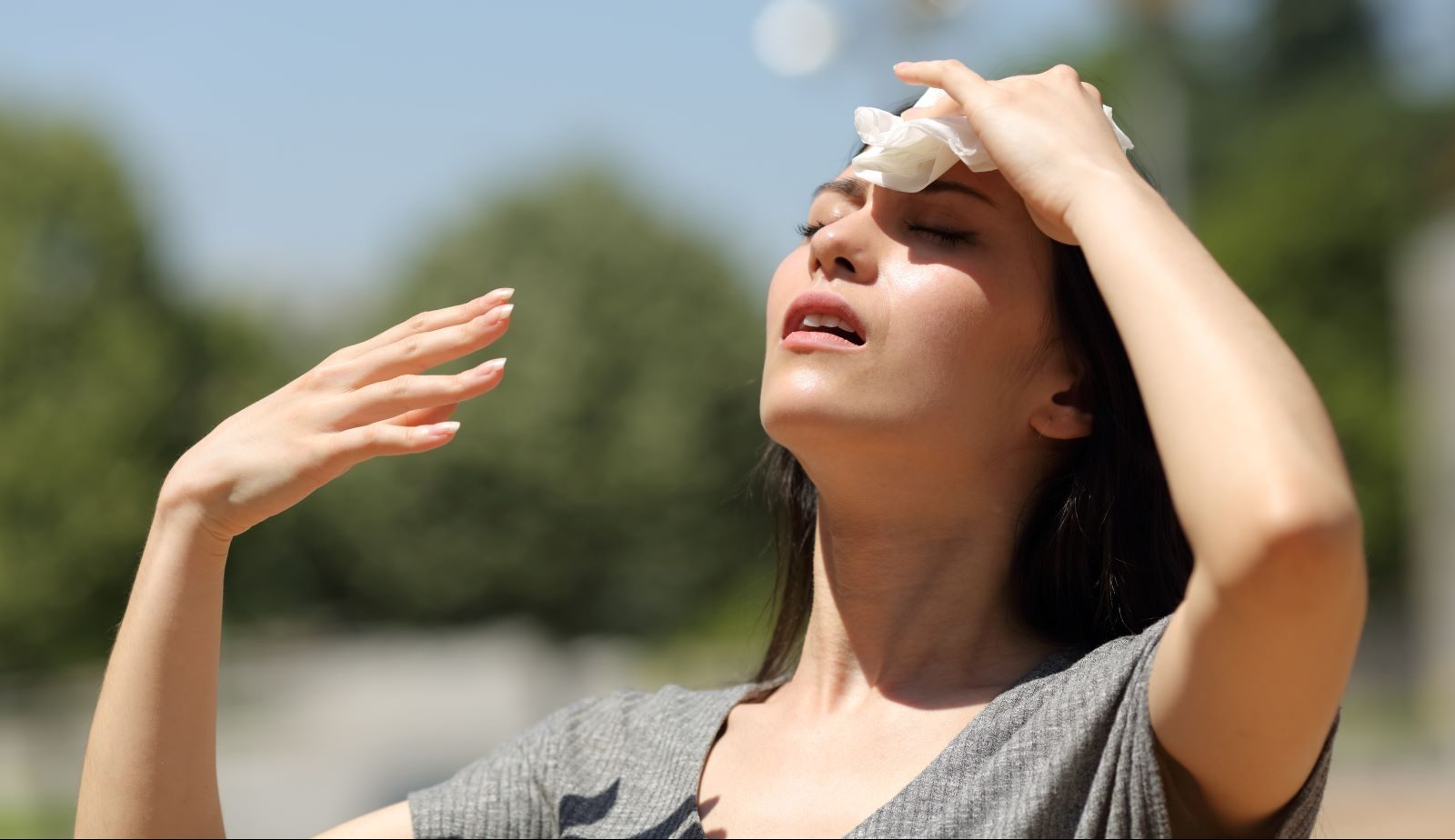 A woman deals with heat waves in the summer.