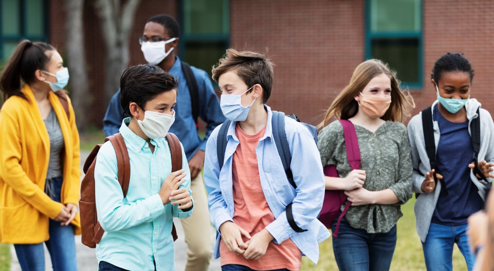 Children wearing masks to protect against COVID at school.
