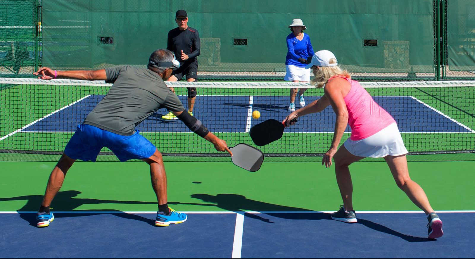 People play pickleball.