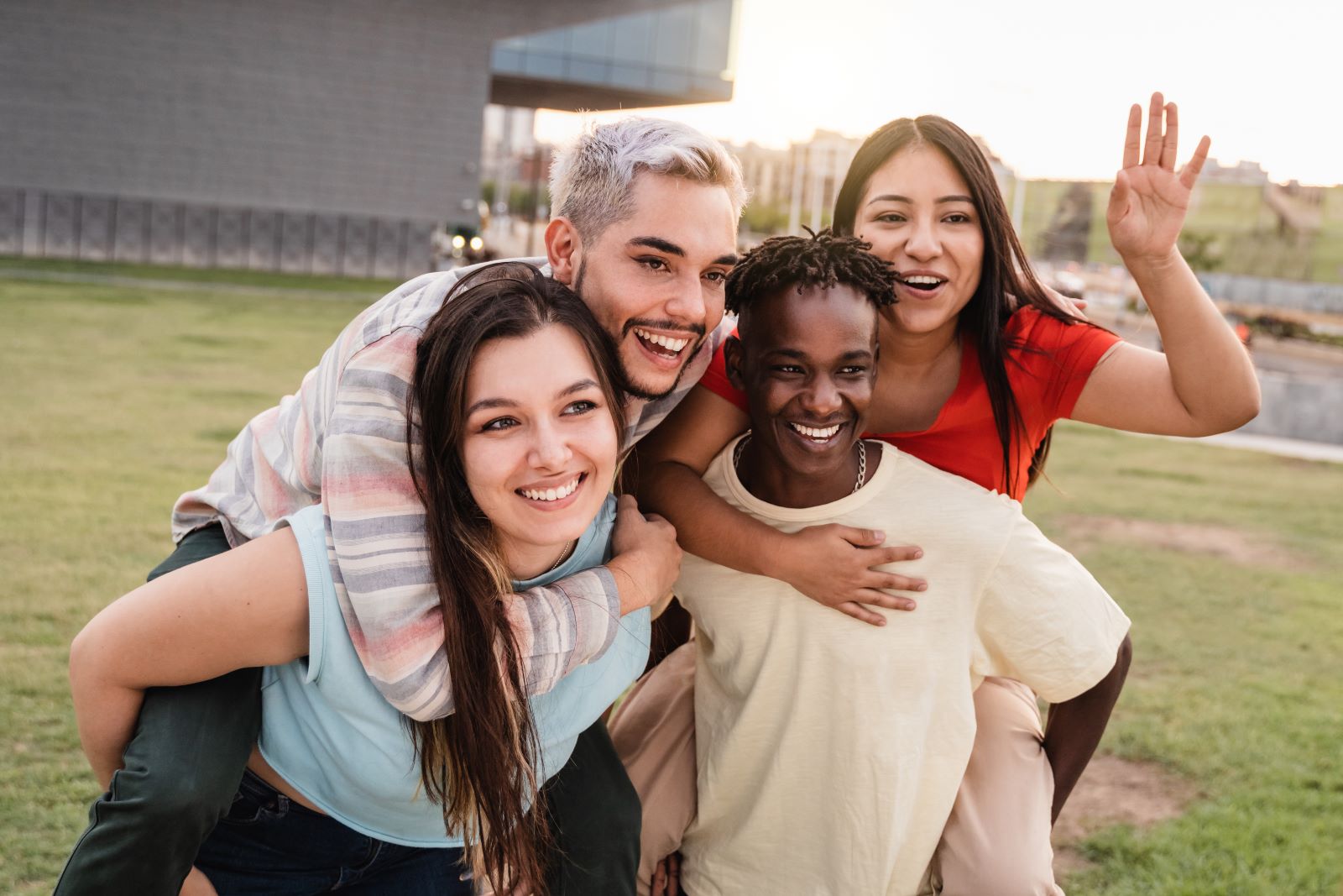 Four teenagers pose for a picture.